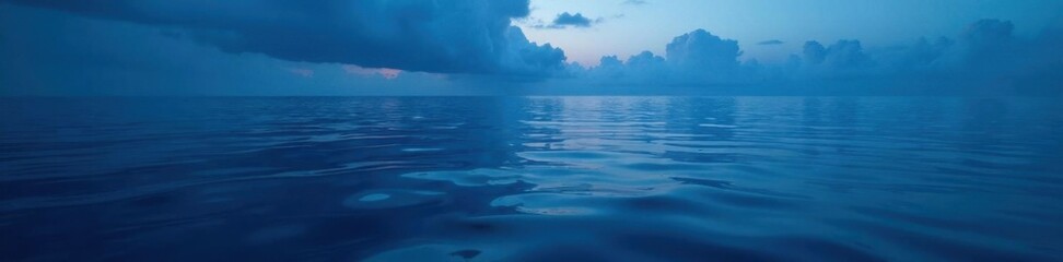 Obraz premium Calm ocean surface reflected with dark blue hue , sea, underwater