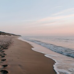 Serene dawn beach landscape, gentle waves, sandy shore, dune background, travel brochure