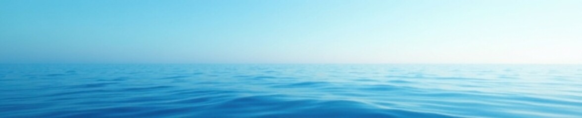 Obraz premium Calming oceanic landscape featuring a gradual transition from deep navy to pale baby blue hues, subtle color change, calming ambiance, gentle wave effect