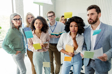 Group of professionals collaborating in an office setting with creative tools and teamwork