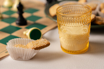 Enjoying cookies and milk during a chess game night