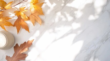 Autumn flat lay with cup of latte and beautiful fall leaves on a marble surface