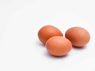 Fresh chicken eggs on a white background. Perfect for projects related to food, healthy eating, cooking, farm products, and advertising