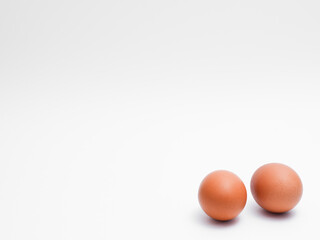 Fresh chicken eggs on a white background. Perfect for projects related to food, healthy eating, cooking, farm products, and advertising