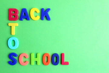 On a green background, the words 