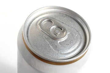 There is an aluminum can on a white background.	