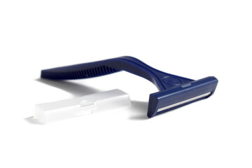 Obraz premium One blue men's razor lies on a white background. 