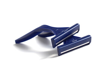 Several men's razors lie on a white background.