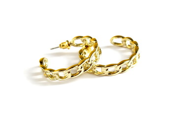 Earrings women's ear jewelry lie on a white background.