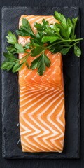 Glistening honey-glazed salmon fillet on dark slate plate, garnished with fresh parsley sprigs for culinary delight display