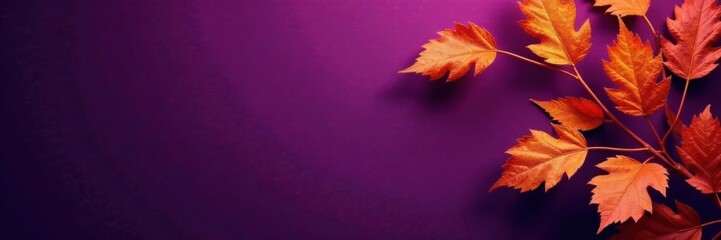 Fototapeta premium Ornate dry orange metallic leaves against a deep violet background, autumnal colors, natural designs
