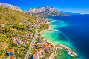 A breathtaking aerial view of Duce, Croatia, showcasing its stunning sandy beaches, crystal-clear Adriatic waters, and scenic coastline, making it one of the most beautiful destinations in Dalmatia