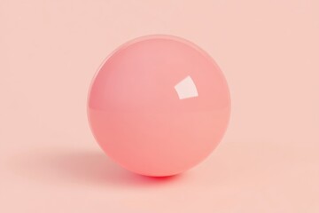 Obraz premium Single, glossy, pink sphere on a pastel pink background
