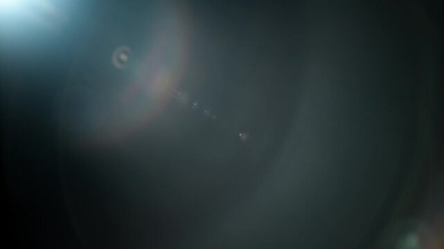 Slow motion real lens flare through glass effects for overlay or transition