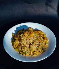 Prepared fried rice in a bowl, fried rice served in a white bowl, typical Asian fried rice dish, healthy homemade fried rice