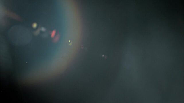 Slow motion real lens flare through glass effects for overlay or transition