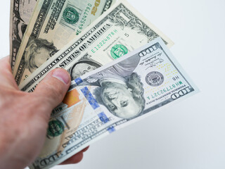 hand holding a dollar