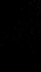 Freeze motion of dust particles flying , isolated on black background