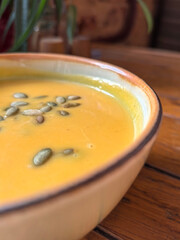 Creamy Pumpkin Soup with Pumpkin Seeds Garnish. Photo taken with a smartphone.