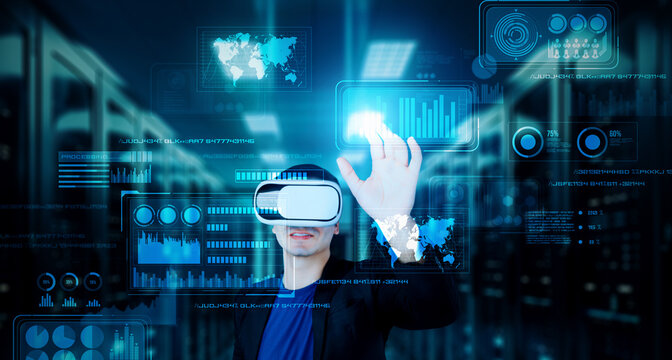 Businessman with headset standing at data center while analyzing financial data. Manager pointing marketing statistic hologram and using augmented reality goggles while making a decision. Ingenuity.