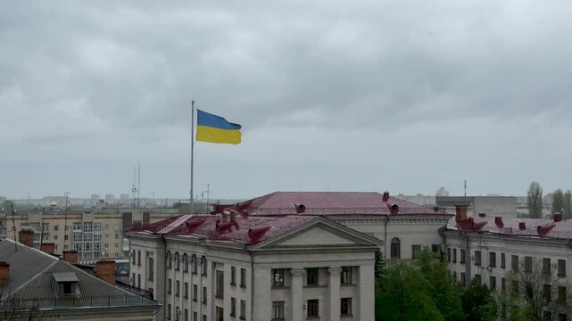 Ukrainian flag in the wind. Blue and yellow flag in the city of Zhytomyr