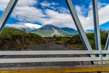 A view of dormant volcanoes from a bridge on the road to Antigua in Guatemala  in early springtime