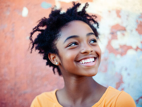 A gritty grainy color portrait of a bright, smiling teenage African American girl in an urban setting radiating happiness.
