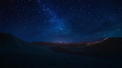 Naklejka premium a night sky filled with stars above a desert