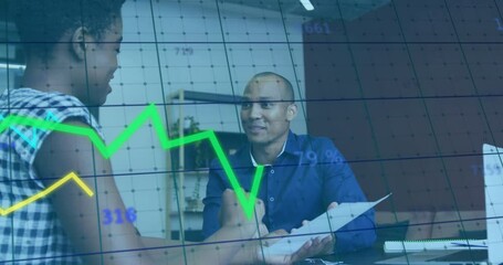 Discussing documents, diverse colleagues in business meeting with financial graph overlay - Powered by Adobe