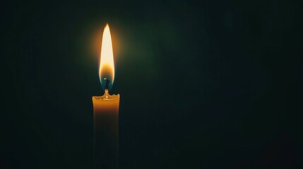 Single Candle Flame Illuminating Darkness with Soft Warm Glow