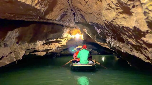 Trang An River Ninh Minh and Bai Dinh Mountain ranges in Vietnam only 3 hours drive from Hanoi. Beautiful winding river and large rising mountains. boats going through the caves in the river