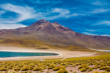 Lagunas altiplanicas Miniques and Miscanti in Chile Atacama desert near San Pedro de Atacama village. Tourist attractions natural sights of Chilean Atacama desert. Dry soil and volcano mountain Andes © Yuliia