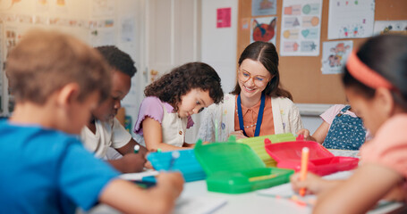 Education, study or writing with students and teacher in classroom of school for child development. Knowledge, learning or teaching with happy woman and kids in lesson for academics, course or growth