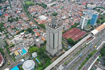 Jakarta, Indonesia - June 11, 2022: Aerial view of Saidah Tower, an old abandoned building located in South Jakarta