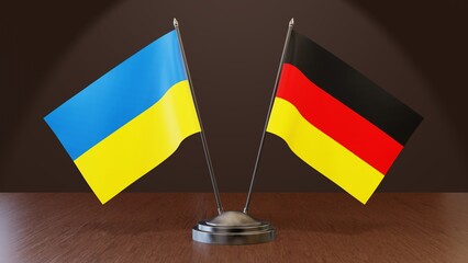 Ukraine and Germany national flags on a table. Negotiations and meetings. Diplomacy and relationship. Suitable for news media. High quality image. 3D rendering.