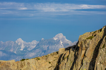 Brevent mountain summit in Chamonix valley. Rocky mountain top with cable car famous for climbing, hiking and paragliding from its slopes. Brevent summit in the Alps on a sunny day