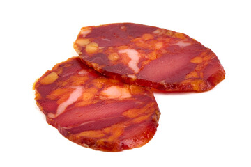 Spicy dry cured chorizo sausage sliced isolated on white background.