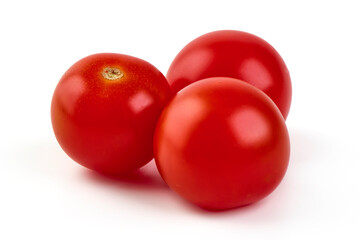 Three fresh red tomatoes isolated on white background.