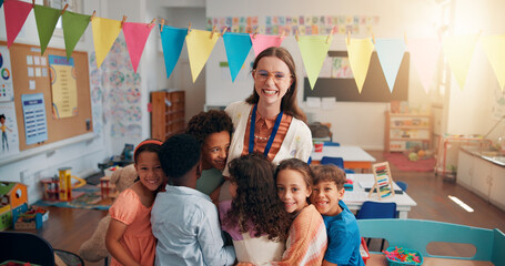 Happy, portrait and children hugging teacher in classroom for bonding, learning and thank you....