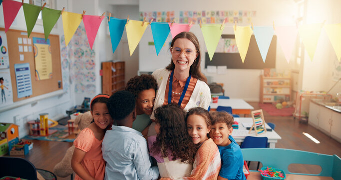 Happy, portrait and children hugging teacher in classroom for bonding, learning and thank you. Love, kids or students embracing woman educator for greeting in morning for lesson at elementary school.