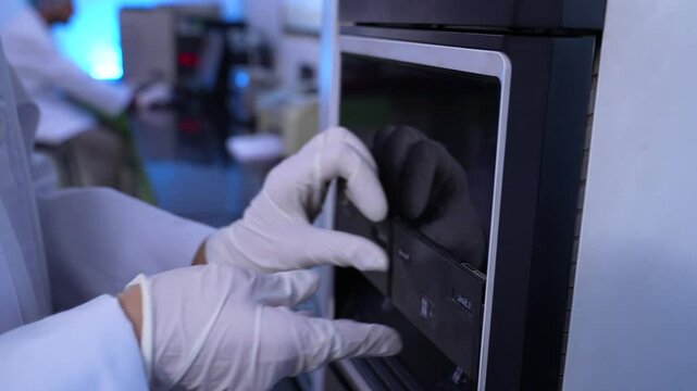 HPLC machine science experiment Vials filling inside an autosampler of an HPLC machine inside view in a Scientific experimental laboratory for research development analysis and ipqa test study	