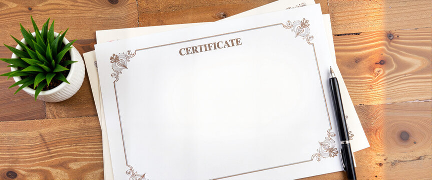 Elegant certificate mockup on wooden desk with pen, professional design
