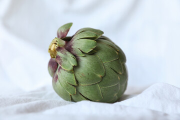 Obraz premium Fresh artichoke on white background. Whole green artichoke mockup. Horizontal.