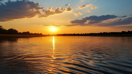 Naklejka premium Golden sunset over a calm river