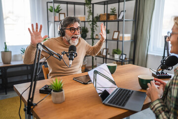 senior man guest in podcast answering on questions to woman host