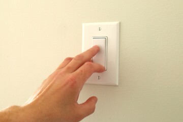 hand with light switch