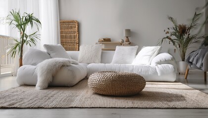 Soft textures meet natural materials in a bright minimalist interior, where a wicker pouf an