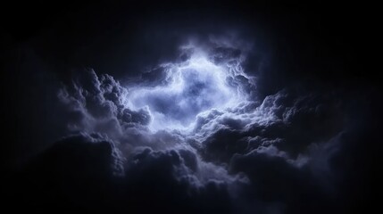 Fototapeta premium Dramatic storm clouds with a luminous center