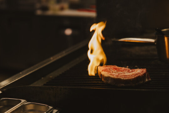 Steak Being Grilled in a Kitchen