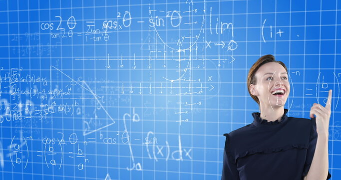 Explaining complex mathematical equations, woman using virtual board in school setting